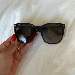 Gucci sunglasses with case.  have had a lot of love so there is wear and tear